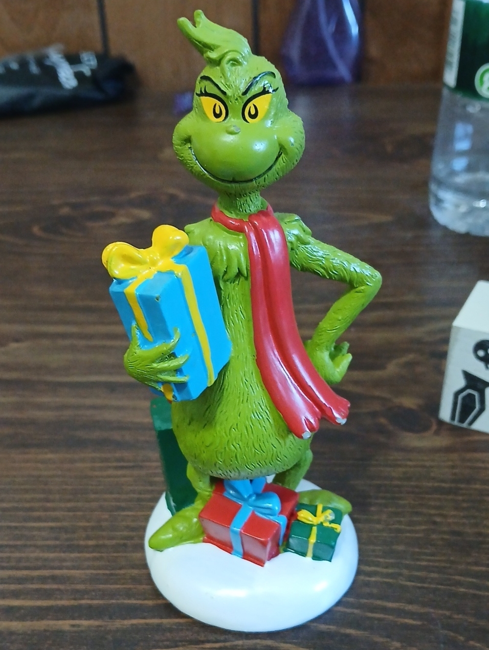 Dr. Seuss Grinch Figurine in Green with Red Scarf and Yellow-Blue Present